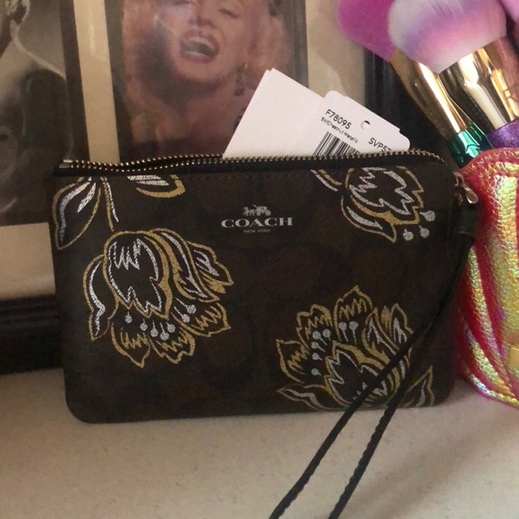Flowered coach wristlet